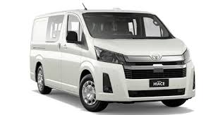 A white Hyundai iLoad 2017 van parked in front of a warehouse in Gold Coast, Australia.